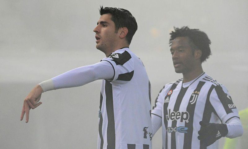 Alvaro Morata (L) and Juan Cuadrado ensured Juventus won at Bologna