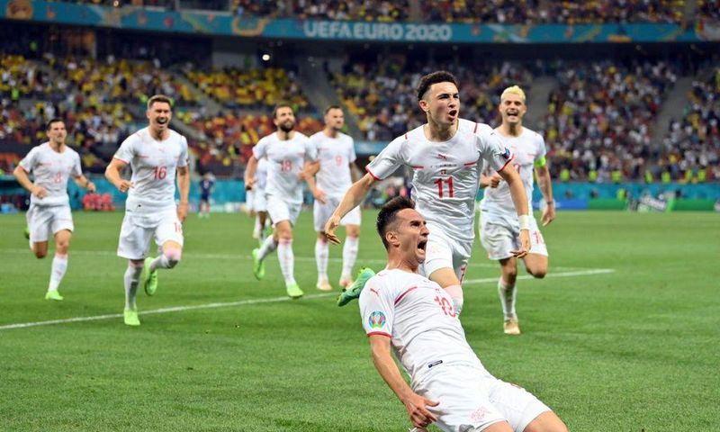 Mario Gavranovic celebrates his late equaliser that forced extra time against France
