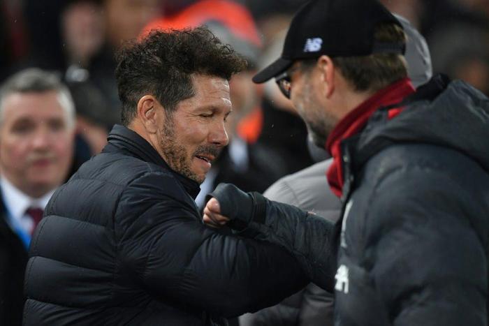 Diego Simeone and Jurgen Klopp bump elbows at Anfield in March 2020
