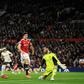 Liverpool forward Mohamed Saleh (2L) completes his hat-trick against Manchester United at Old Trafford on Sunday.