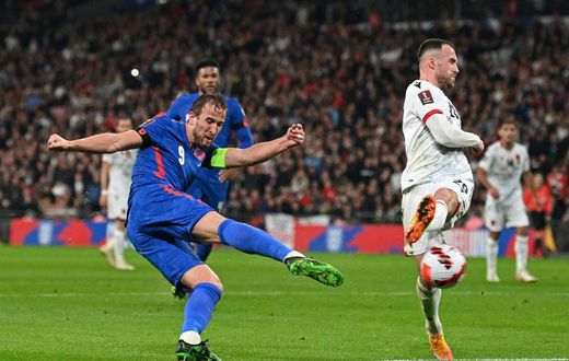 Captain fantastic: Harry Kane (left)scored a first-half hat-trick as England thrashed Albania