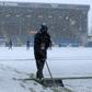 Groundstaff clear snow at Burnley's Turf Moor ground