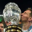 Argentina's Lionel Messi kisses the trophy after winning the Copa America for the first time following a 1-0 win over Brazil