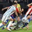 Argentina's Lionel Messi (center) received some close attention in the World Cup qualifier against Paraguay that ended goalless