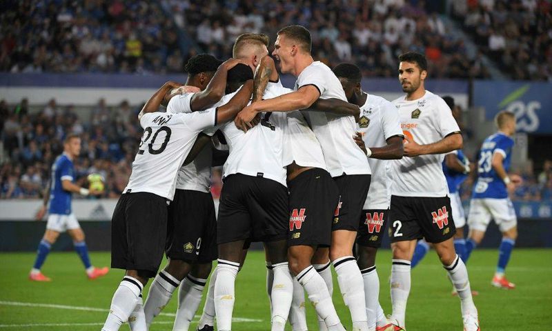 Lille players celebrate after Jonathan David put them ahead against Strasbourg