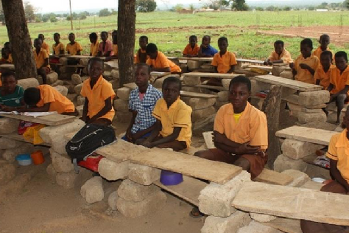 Pupils study on cement blocks (File photo)