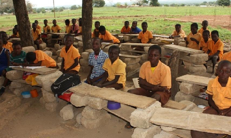Pupils study on cement blocks (File photo)