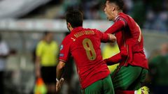 Cristiano Ronaldo (R) scored a dramatic late double to take his tally to 111 international goals