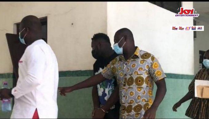 Medikal handcuffed to court