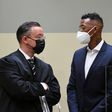 Germany defender Jerome Boateng (R) talks to his lawyer Kai Walden in Munich regional court on Thursday
