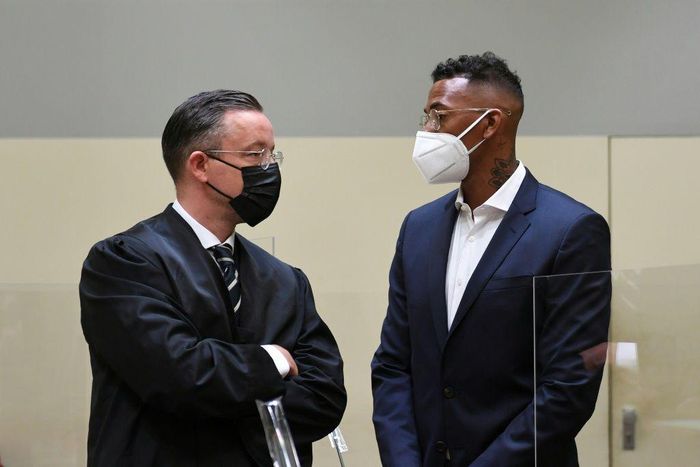 Germany defender Jerome Boateng (R) talks to his lawyer Kai Walden in Munich regional court on Thursday