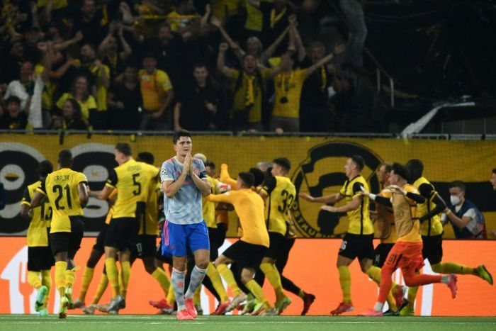 Harry Maguire walks away as Young Boys celebrate their last-gasp winner in Bern
