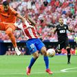 Artful dodger: Angel Correa dodged a challenge from goalie Kiko Casillas and ran on to score