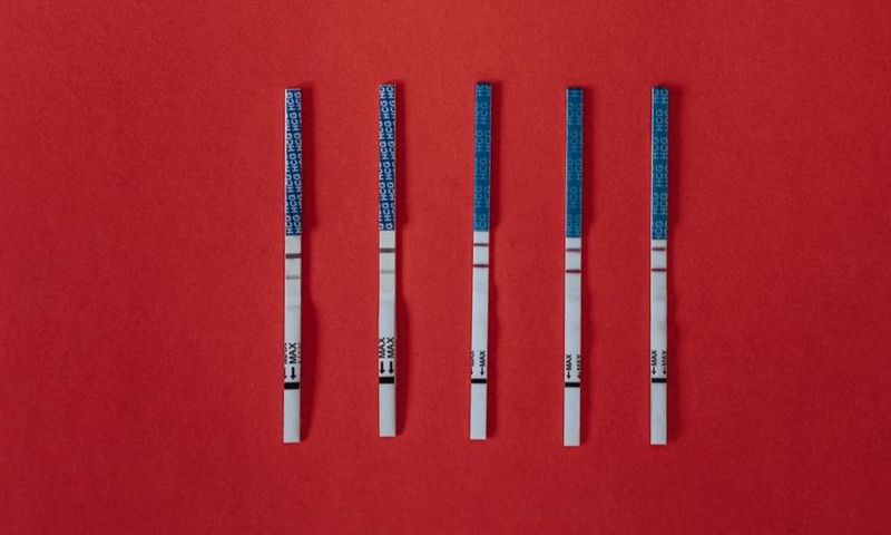 Close-up shot of positive pregnancy test strips [Image: Olia Danilevich]