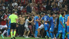 The match between Nice and Marseille was halted in the 75th minute as bottles were thrown and fans invaded the pitch