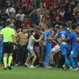 The match between Nice and Marseille was halted in the 75th minute as bottles were thrown and fans invaded the pitch