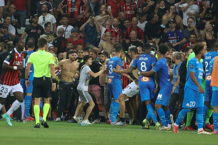 The match between Nice and Marseille was halted in the 75th minute as bottles were thrown and fans invaded the pitch