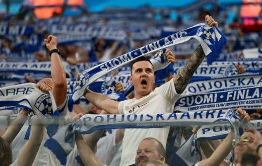 Finland fans cheer on their team against Belgium in Russia