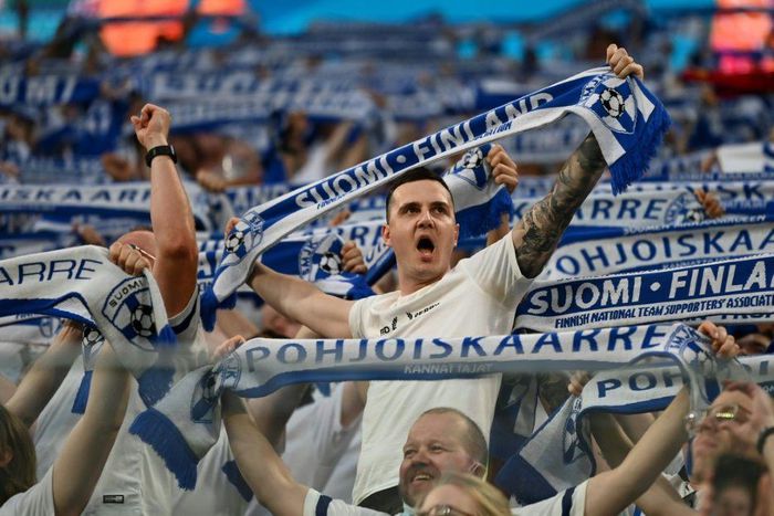 Finland fans cheer on their team against Belgium in Russia