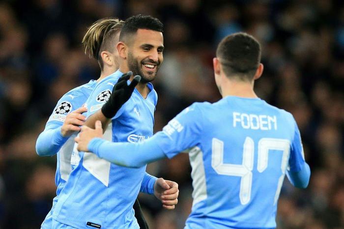 Manchester City forward Riyad Mahrez celebrates scoring against Club Brugge