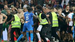 Flash point: Security try to hold back fans as they invade the pitch  at Nice's Allianz Riviera Stadium