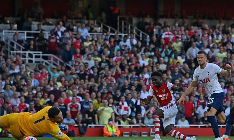Bukayo Saka (centre)scored Arsenal's third goal against Tottenham