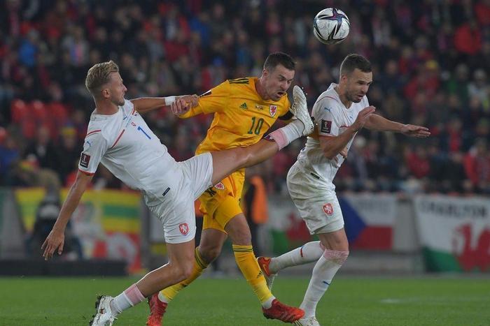 Man in the middle: Czech Republic's Antonin Barak (left) and Filip Novak (right) challenge Wales midfielder Aaron Ramsey