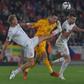 Man in the middle: Czech Republic's Antonin Barak (left) and Filip Novak (right) challenge Wales midfielder Aaron Ramsey