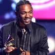 Kendrick Lamar onstage with his Grammys [billboard]