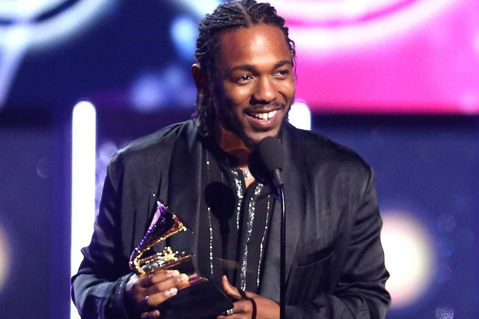 Kendrick Lamar onstage with his Grammys [billboard]