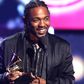 Kendrick Lamar onstage with his Grammys [billboard]