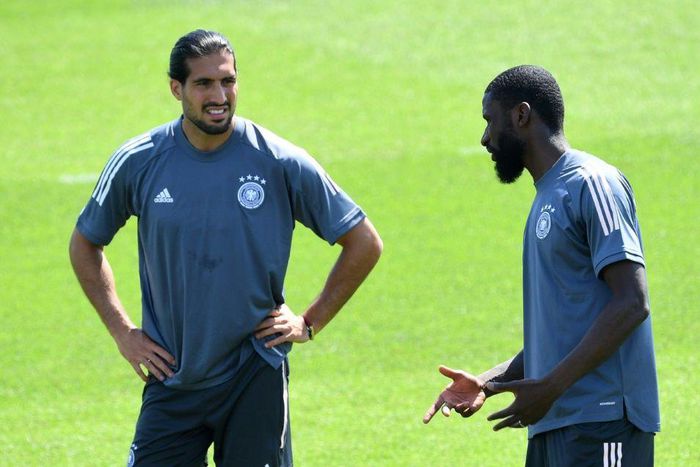 Germany defender Antonio Ruediger (R) chats with Emre Can during training on Monday in Herzogenaurach