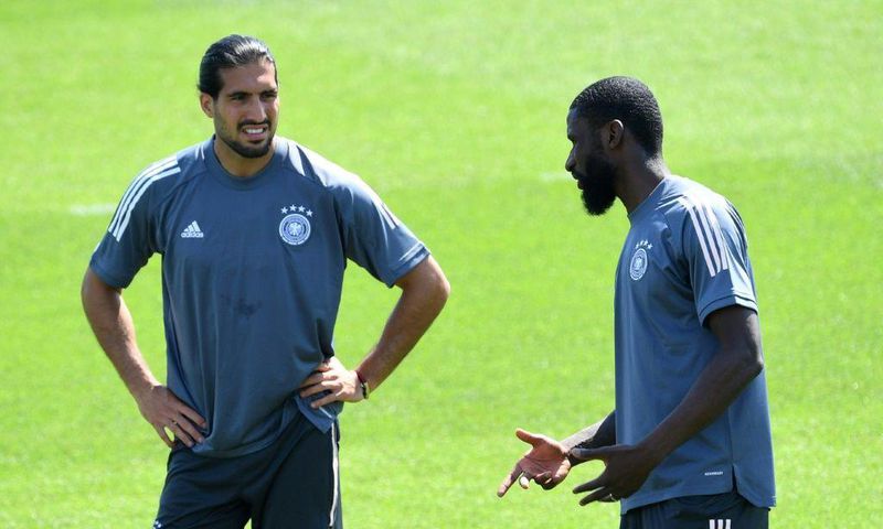 Germany defender Antonio Ruediger (R) chats with Emre Can during training on Monday in Herzogenaurach