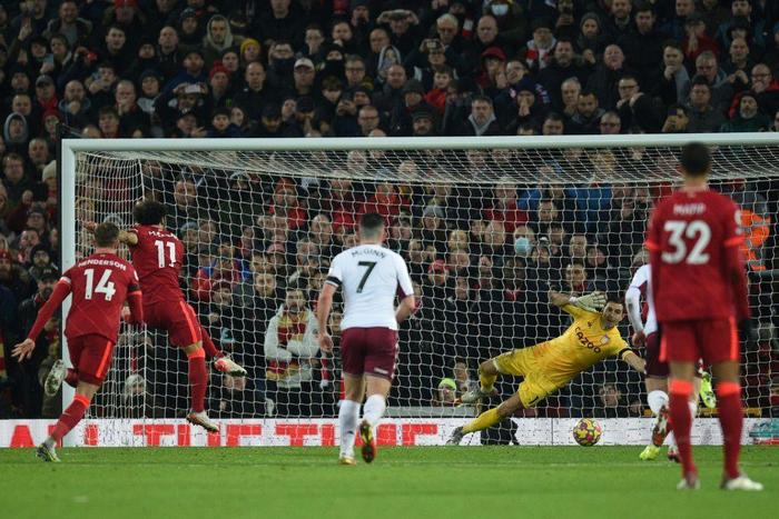 Egyptian Mohamed Salah (2L) converts a penalty to give Liverpool a Premier League victory over Aston Villa at Anfield.