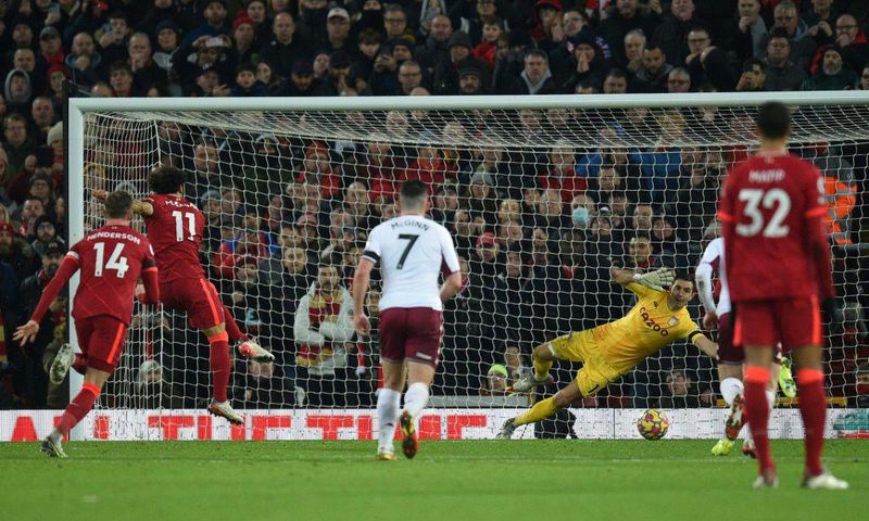 Egyptian Mohamed Salah (2L) converts a penalty to give Liverpool a Premier League victory over Aston Villa at Anfield.