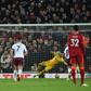 Egyptian Mohamed Salah (2L) converts a penalty to give Liverpool a Premier League victory over Aston Villa at Anfield.