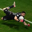 Argentina goalkeeper Emiliano Martinez makes one of three penalty shoot-out saves to send his country into a dream Copa America final against Brazil