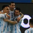 Lautaro Martinez (left) celebrates with his Argentina teammates Angel Di Maria (center) and Lionel Messi (right) after opening the scoring against Venezuela