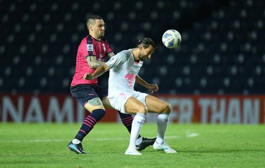 Record breaker: Hong Kong's Kitchee's Dejan Damjanovic (right) in action