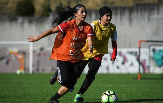 Players of Afghanistan national women's youth football team attend a training session on the outskirts of Lisbon where they have found safe haven after escaping from the Taliban