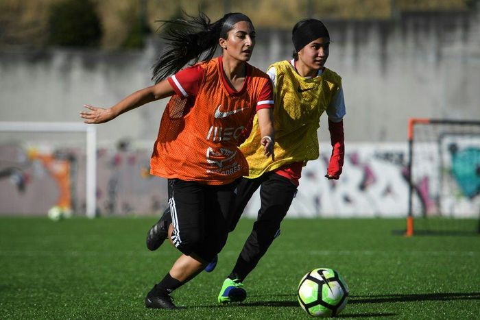 Players of Afghanistan national women's youth football team attend a training session on the outskirts of Lisbon where they have found safe haven after escaping from the Taliban