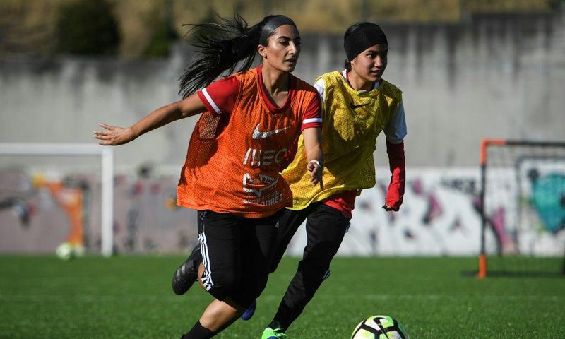 Players of Afghanistan national women's youth football team attend a training session on the outskirts of Lisbon where they have found safe haven after escaping from the Taliban