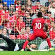 Senegalese Sadio Mane (R) scores his 100th goal for Liverpool in a 3-0 victory over Crystal Palace at Anfield