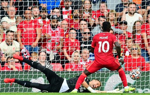 Senegalese Sadio Mane (R) scores his 100th goal for Liverpool in a 3-0 victory over Crystal Palace at Anfield