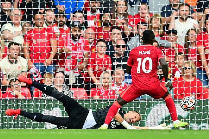 Senegalese Sadio Mane (R) scores his 100th goal for Liverpool in a 3-0 victory over Crystal Palace at Anfield