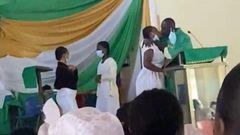 Anglican Priest kissing students