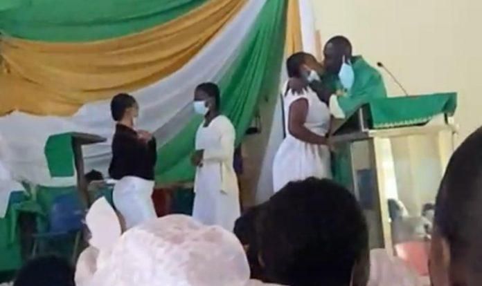 Anglican Priest kissing students