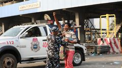 Police Task Force arresting a peaceful protester at the Lekki Toll Gate Plaza