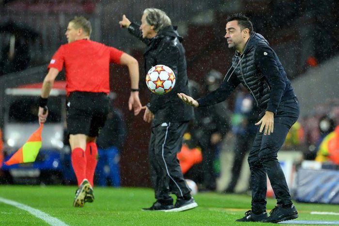 Barcelona coach Xavi (right)