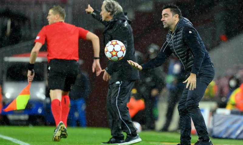 Barcelona coach Xavi (right)